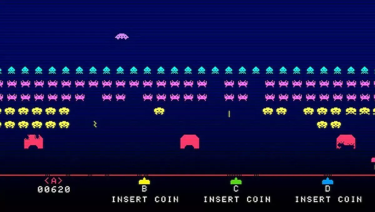 Space Invaders gameplay showing a laser cannon shooting waves of descending alien invaders